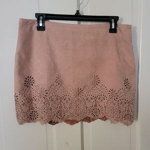 Tan color mini skirt with beautiful detail on the bottom